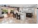 Open floor plan with tile floors, white kitchen, and spiral staircase at 1721 Allens Creek Dr, Clearwater, FL 33764
