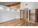 Bright living room with wood floors, recessed lighting, and a decorative transom window at 1721 Allens Creek Dr, Clearwater, FL 33764