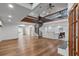 Spacious living room with spiral staircase, open to the kitchen, and wood floors at 1721 Allens Creek Dr, Clearwater, FL 33764