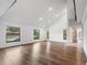 Open living room with wood floors, recessed lighting, and view of the front yard at 1721 Allens Creek Dr, Clearwater, FL 33764