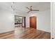 Spacious living room with hardwood floors and view to the game room at 1721 Allens Creek Dr, Clearwater, FL 33764