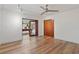 Open living room with hardwood floors and view to the game room at 1721 Allens Creek Dr, Clearwater, FL 33764