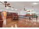 Spacious living area features hardwood floors, built-in shelving and staircase at 1721 Allens Creek Dr, Clearwater, FL 33764