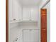 Walk-in pantry featuring ample shelving and cabinetry space with quartz countertops at 1721 Allens Creek Dr, Clearwater, FL 33764