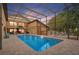 Sparkling pool surrounded by a screened enclosure and brick pavers, creating an ideal outdoor oasis at 1721 Allens Creek Dr, Clearwater, FL 33764