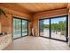 Enclosed porch with wood walls, tile floors, and sliding glass doors to a pool and deck at 1721 Allens Creek Dr, Clearwater, FL 33764