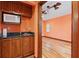 View of a room with hardwood floors, cabinets, and sink at 1721 Allens Creek Dr, Clearwater, FL 33764