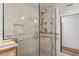 Modern shower with glass enclosure, neutral tile, mosaic details, and multiple shower heads for a spa-like experience at 1721 Allens Creek Dr, Clearwater, FL 33764