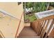 View of a stairway descending into a backyard lush with trees, providing a serene view at 1721 Allens Creek Dr, Clearwater, FL 33764