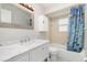 Bathroom featuring a marble vanity, mirror and cabinet at 1839 Neptune Dr, Englewood, FL 34223