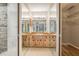 Bathroom featuring multiple mirrors, sinks, and a walk-in closet at 1839 Neptune Dr, Englewood, FL 34223