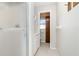 Bathroom with shower stall, tiled floors and white cabinets with adjacent toilet room at 1839 Neptune Dr, Englewood, FL 34223