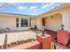 Inviting front porch featuring a quaint seating area and lovely landscaping, enhancing the home's curb appeal at 1839 Neptune Dr, Englewood, FL 34223