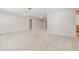 Expansive living area featuring tile flooring and neutral tones, creating a versatile and inviting space at 1839 Neptune Dr, Englewood, FL 34223