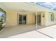 Covered patio with ample space for outdoor lounging and dining at 1839 Neptune Dr, Englewood, FL 34223