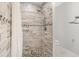 Walk-in shower with stylish tile and pebble-stone floor at 1839 Neptune Dr, Englewood, FL 34223