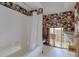 Bathroom featuring a bathtub with shower, vintage wallpaper, and ready for a full renovation at 1897 Dolphin S Blvd, St Petersburg, FL 33707