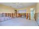 Unfinished bedroom with view to bathroom, exposed walls, and bright overhead lighting at 1897 Dolphin S Blvd, St Petersburg, FL 33707