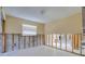 Empty bedroom with large window and open access to other rooms needing complete renovation at 1897 Dolphin S Blvd, St Petersburg, FL 33707