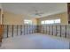Unfinished bedroom with concrete walls, exposed wiring, and two windows providing natural light at 1897 Dolphin S Blvd, St Petersburg, FL 33707