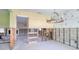 Open dining room showcasing chandelier lighting and an open layout ready for complete renovation at 1897 Dolphin S Blvd, St Petersburg, FL 33707
