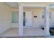 Inviting front entry with a decorative front door, side tile, and well kept columns at 1897 Dolphin S Blvd, St Petersburg, FL 33707
