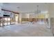 Expansive living room with open floor plan, fireplace, and kitchen area, perfect for remodeling at 1897 Dolphin S Blvd, St Petersburg, FL 33707