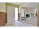 Bright living room with fireplace and open doorway, ready to be renovated at 1897 Dolphin S Blvd, St Petersburg, FL 33707