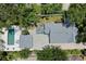 Aerial view of the property, highlighting the backyard, pool, deck, and surrounding landscape at 1915 10Th N St, St Petersburg, FL 33704