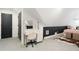Cozy bedroom featuring a vanity, sloped ceilings, plush carpeting, and modern decor at 1915 10Th N St, St Petersburg, FL 33704