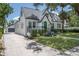 Beautifully landscaped home with a long driveway that leads to a detached garage and ample parking at 1915 10Th N St, St Petersburg, FL 33704