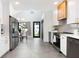 Bright, open kitchen with modern appliances, white cabinets, and adjacent dining area with backyard access at 1915 10Th N St, St Petersburg, FL 33704