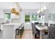 Eat-in kitchen with an island and bar seating, seamlessly connected to a dining area for entertaining at 1915 10Th N St, St Petersburg, FL 33704