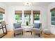 Cozy sitting area with large windows, providing lots of natural light, and modern decor at 1915 10Th N St, St Petersburg, FL 33704
