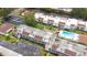 Aerial shot showcasing condos with parking, shuffleboard courts, and community pool at 2060 Marilyn St # 114, Clearwater, FL 33765