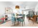 Bright condo dining area with beachy decor, light wood floors, and comfortable seating at 2060 Marilyn St # 114, Clearwater, FL 33765