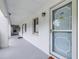 Inviting condo hallway with a light-colored door and a small window at 2060 Marilyn St # 114, Clearwater, FL 33765