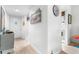 Bright condo hallway with light wood floors and beach-themed decorations at 2060 Marilyn St # 114, Clearwater, FL 33765