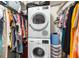 Laundry closet with stacked washer and dryer unit, plus space for storage at 2060 Marilyn St # 114, Clearwater, FL 33765