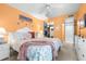 Comfortable bedroom features in-unit washer/dryer access and coastal decor, enhancing convenience and style at 2060 Marilyn St # 114, Clearwater, FL 33765