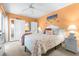 Bright bedroom with coastal-themed decor, ceiling fan, and ample closet space offers a tranquil retreat at 2060 Marilyn St # 114, Clearwater, FL 33765
