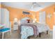 Stylish bedroom with coastal-themed decor, side table, and desk area provides a relaxing and functional living space at 2060 Marilyn St # 114, Clearwater, FL 33765