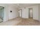 Spacious bedroom with neutral walls, carpet, ceiling fan, and access to other rooms for easy living at 210 Martha Ln # 210, Oldsmar, FL 34677