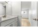 Bathroom featuring new vanity and walk in shower at 241 Skiff Pt # 1, Clearwater Beach, FL 33767
