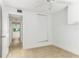 Bright bedroom featuring tile floors, closet and a ceiling fan at 241 Skiff Pt # 1, Clearwater Beach, FL 33767