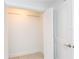Walk in closet featuring built in shelving and tile floors at 241 Skiff Pt # 1, Clearwater Beach, FL 33767