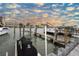 Serene harbor and dock with a jet ski lift and gorgeous sky at 241 Skiff Pt # 1, Clearwater Beach, FL 33767