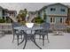 Outdoor seating with a waterfront view surrounded by tropical landscaping at 241 Skiff Pt # 1, Clearwater Beach, FL 33767