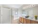 Bright and airy bathroom with a soaking tub, glass shower, and double vanity sinks at 25729 Aldus Dr, Land O Lakes, FL 34639