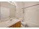 A clean bathroom featuring a tub and shower combination and wood vanity with a white sink at 25729 Aldus Dr, Land O Lakes, FL 34639